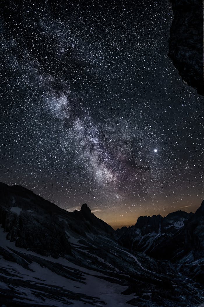 services-03 Breathtaking view of the Milky Way galaxy over the mountain peaks in Vigo di Fassa, Italy.